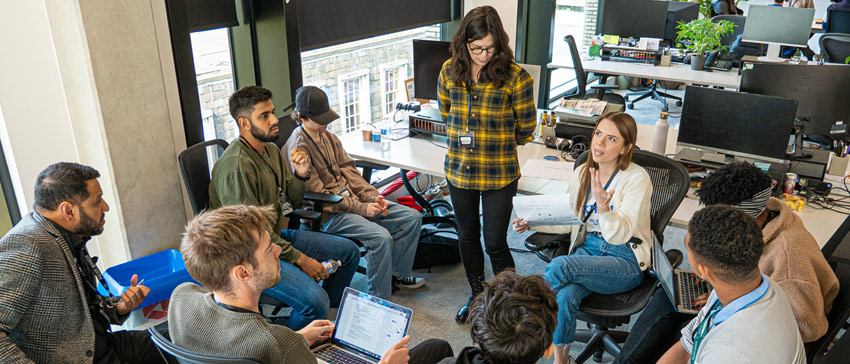 People sitting around in an office having a meeting